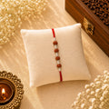 Four Rudraksh with Balls Silver Rakhi